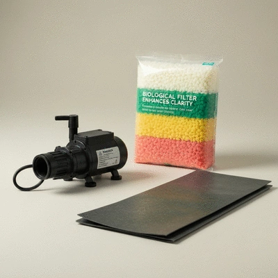 Variety of koi pond equipment including a pump, filter, and liner sample, arranged neatly